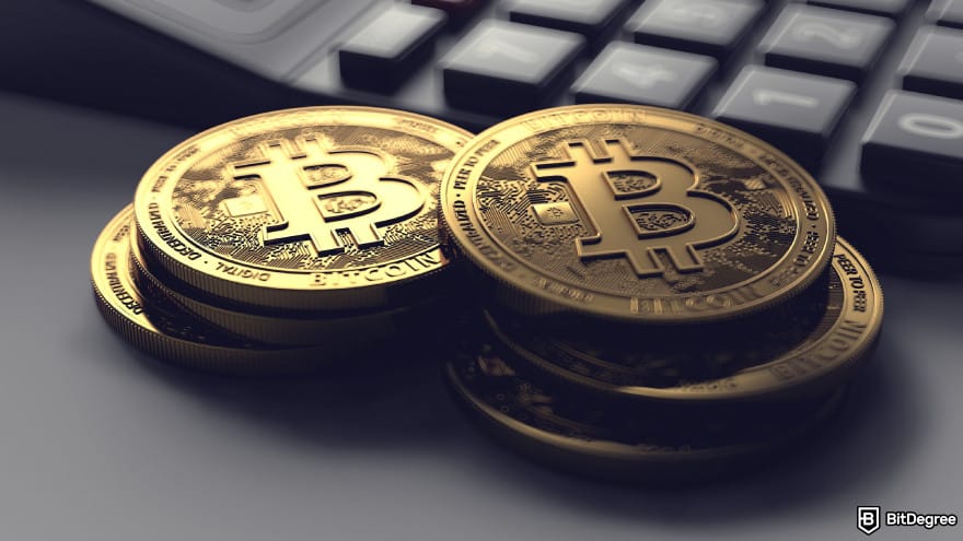 Best hybrid crypto exchange: a pile of Bitcoins next to a keyboard.