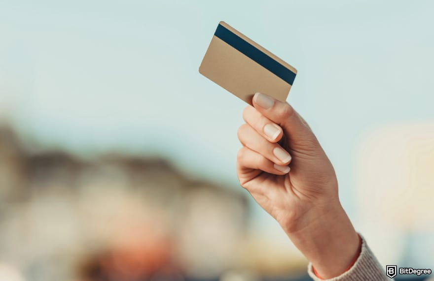 Best international money transfer: a person holding a card.