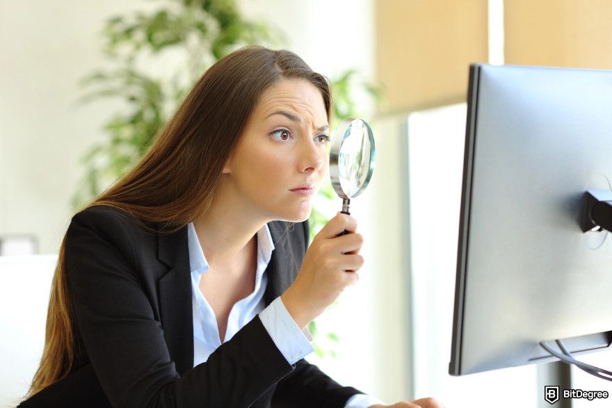 Best low market cap crypto: using a magnifying glass.