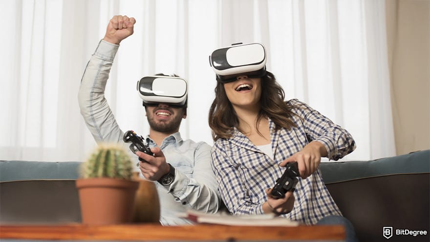 Best metaverse crypto: a man and woman are fully immersed in a virtual reality experience, both wearing VR headsets.