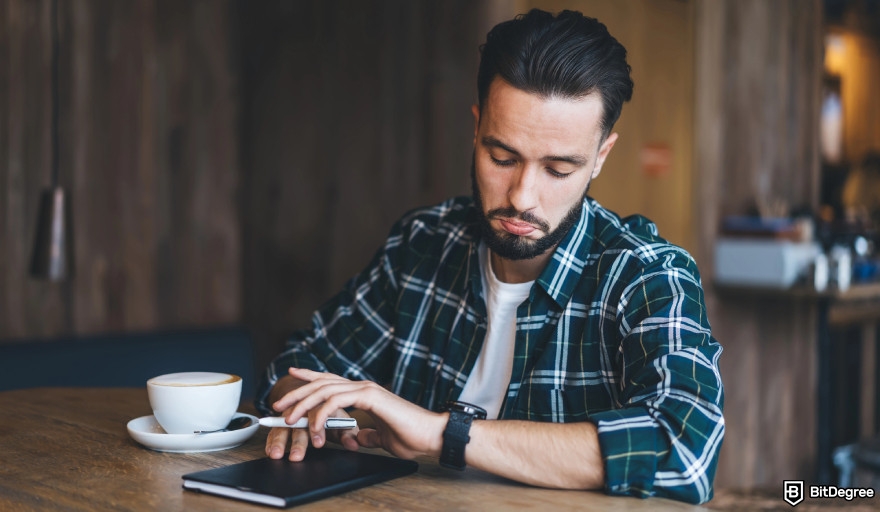 Best money making app: a man looking at his watch.