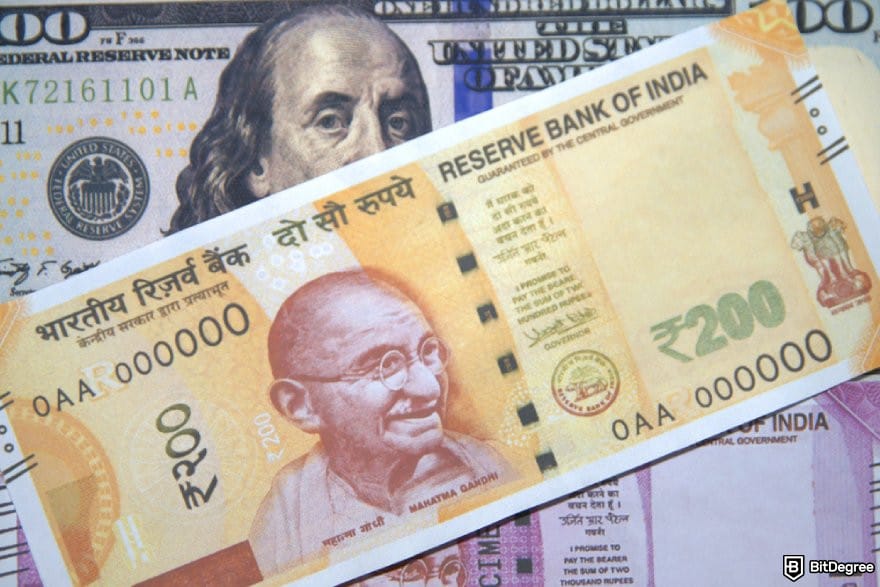 Best money transfer to India: an INR 200 bill on a USD 100 bill.