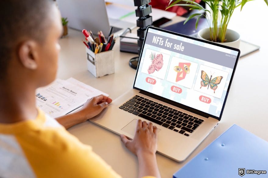 Best NFT wallet: a person looking at an NFT marketplace on a laptop.