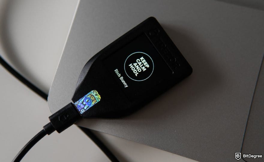 Best NFT wallet: a Trezor wallet connected to a laptop.