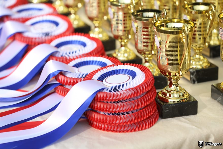 Best online raffle site: medals and award cups stacked in a row.