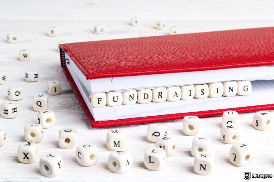 Best online raffle site: a red notebook with dice that spell Fundraising.
