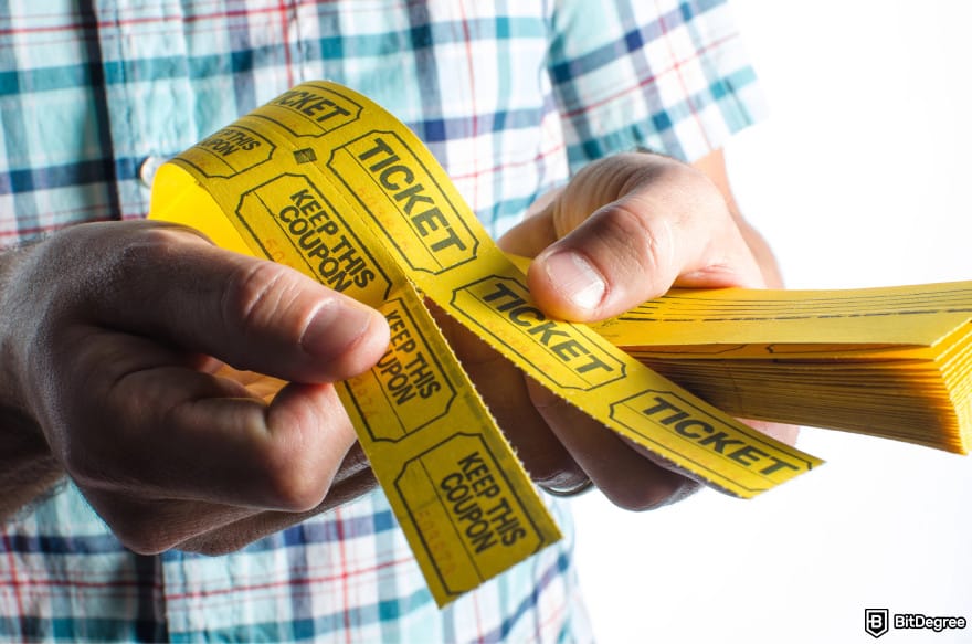 Best online raffle site: a person holding tickets.