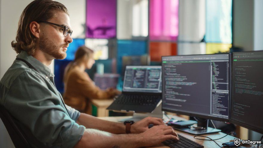 Best programming courses for beginners: a person working on lines of code on a computer.