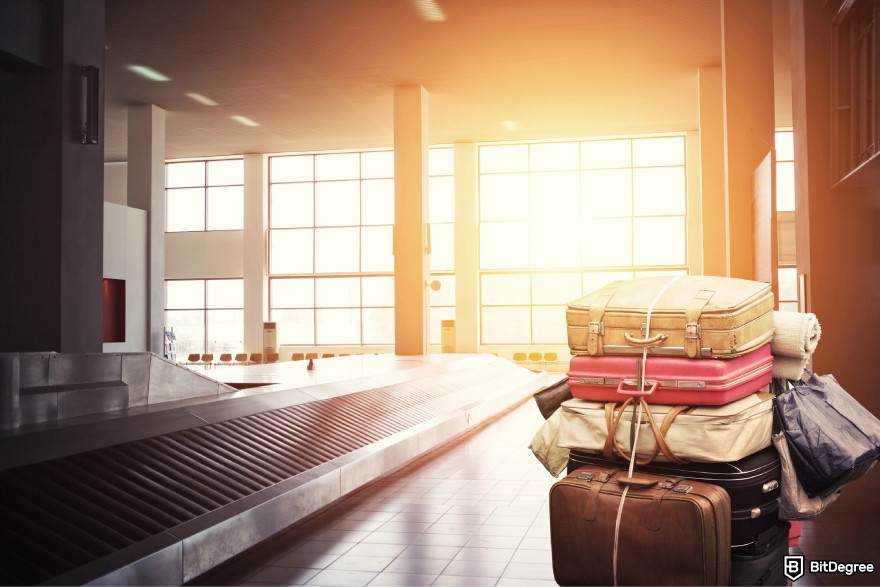 Best referral programs: a pile of suitcases.