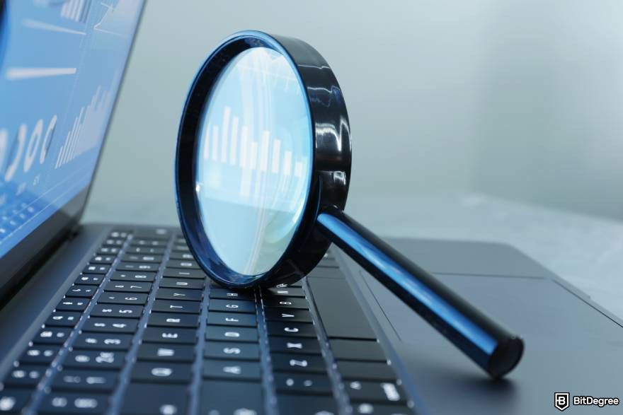 Best Solana presales: a magnifying glass on a laptop.