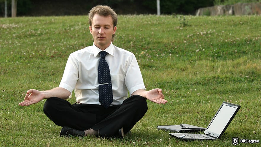 Best stablecoin: businessman doing yoga.