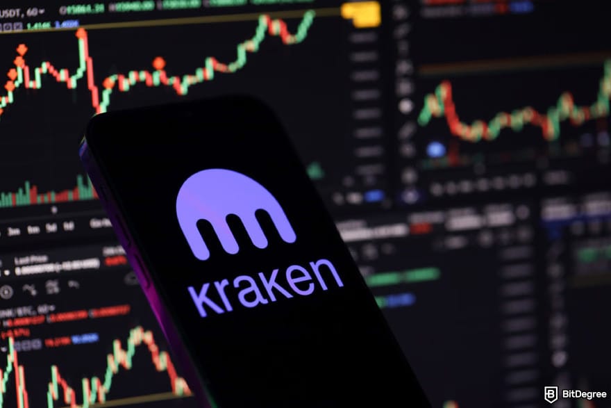 Best stablecoin: a phone showing Kraken exchange logo in front of screen showing chart.