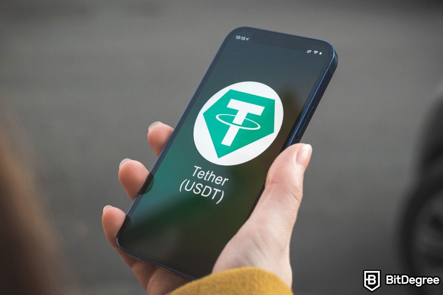 Best stablecoin: a phone screen showing Tether logo.