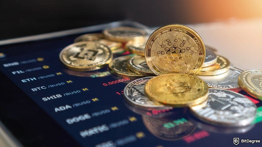 Best staking crypto: various crypto coins on a phone screen.