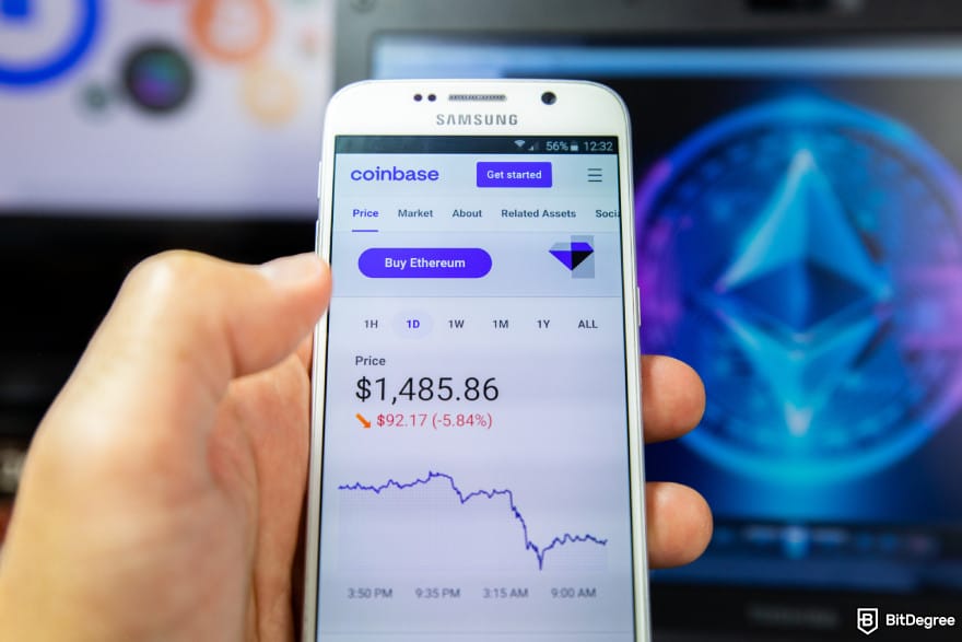Best Sui wallet: a person holding a phone that shows Ethereum's price and performance graph on the Coinbase Wallet app.