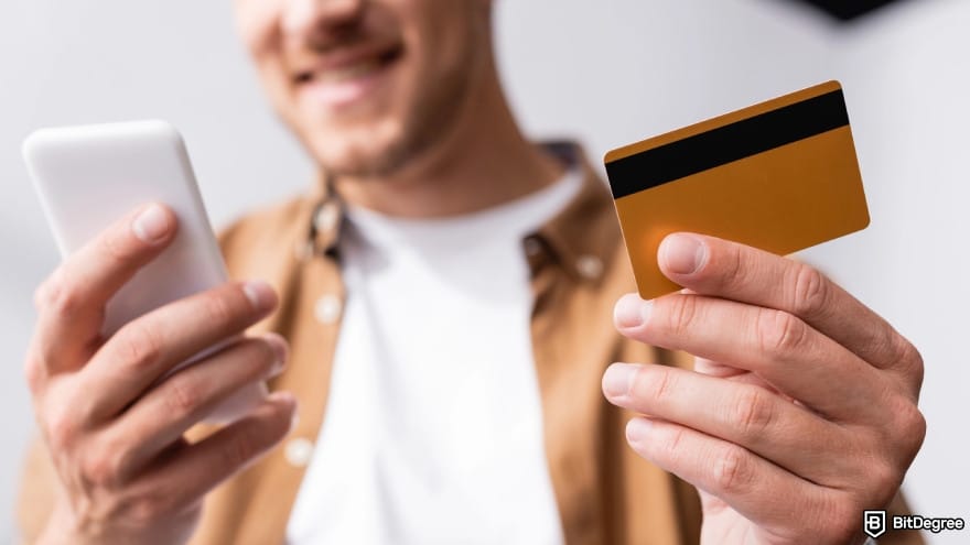 Best way to send money anonymously: a person holding credit card and using a smartphone. Best way to send money anonymously: a person holding credit card and using a smartphone.