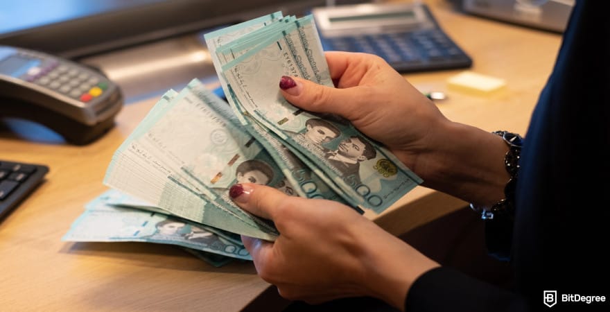 Best way to send money to Dominican Republic: a person counting Dominican peso bills manually. Best way to send money to Dominican Republic: a person counting Dominican peso bills manually.