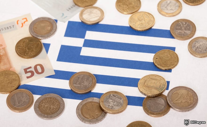 Best way to send money to Greece: Greek coins on top of Greek flag.