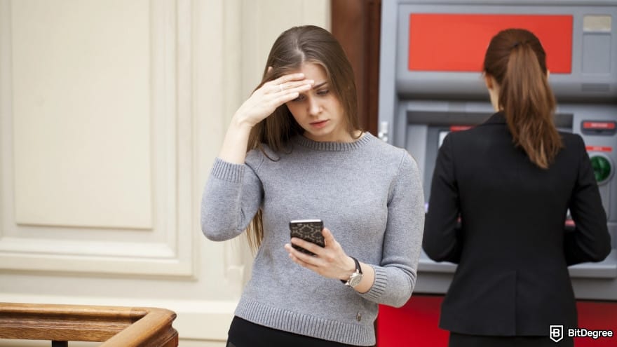 Best way to send money to Mexico: frustrated woman stands on against ATM.