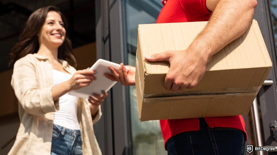 Best way to send money to Mexico: low angle view of delivery man giving a package to happy person.