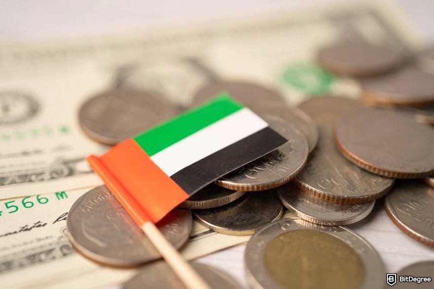 Best way to send money to UAE: stacks of coins with a small UAE flag. Best way to send money to UAE: stacks of coins with a small UAE flag.