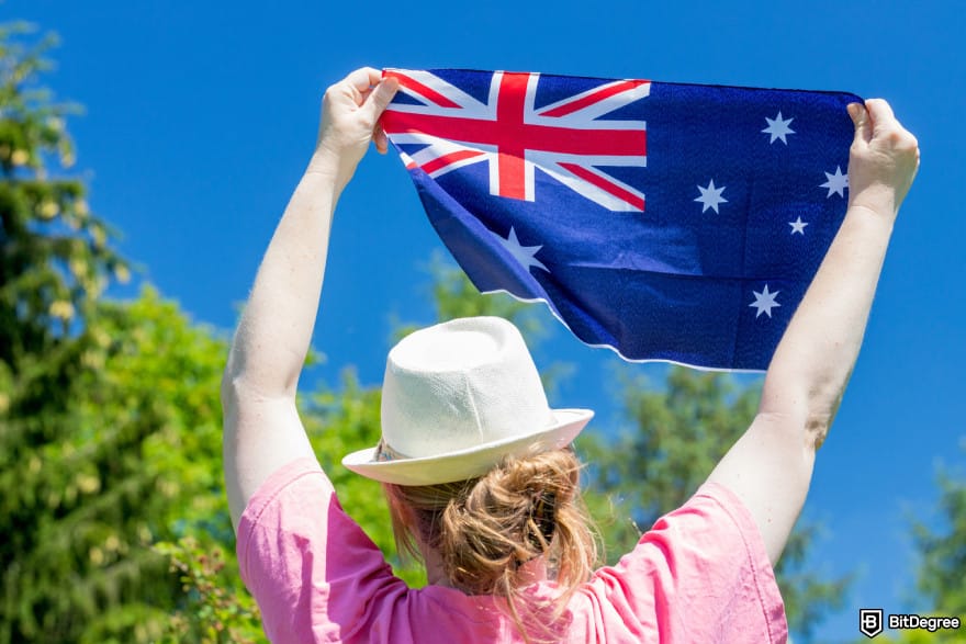 Best way to send money to Vietnam: a person holding the Australian flag.