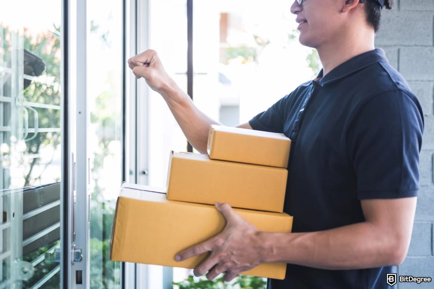 Best way to send money to Vietnam: a deliver person holding packages.