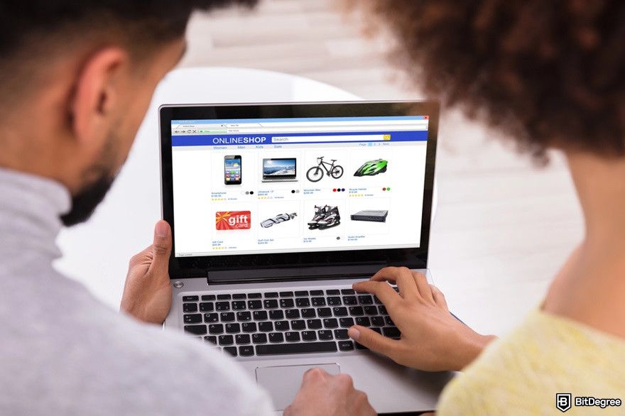 Best XRP meme coins: a couple using a laptop for shopping online.