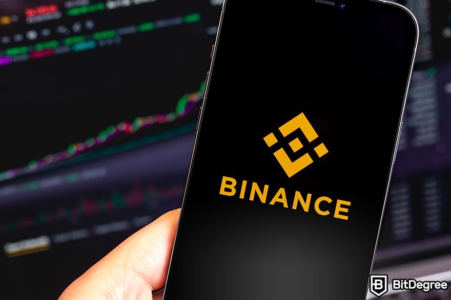 Binance spot trading: Binance logo on a phone screen.