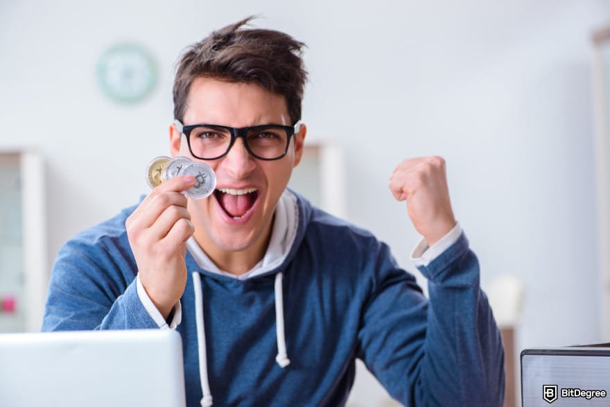 Binance taxes: young man winning Bitcoins.