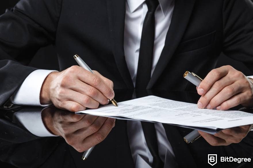 Bitcoin CFD: A man in a suit and tie checking a document