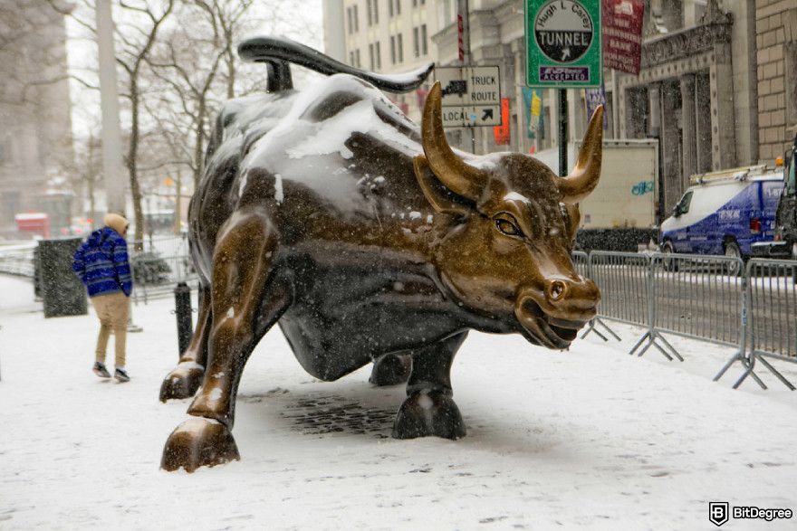 Bitcoin cycles: charging bull statue.