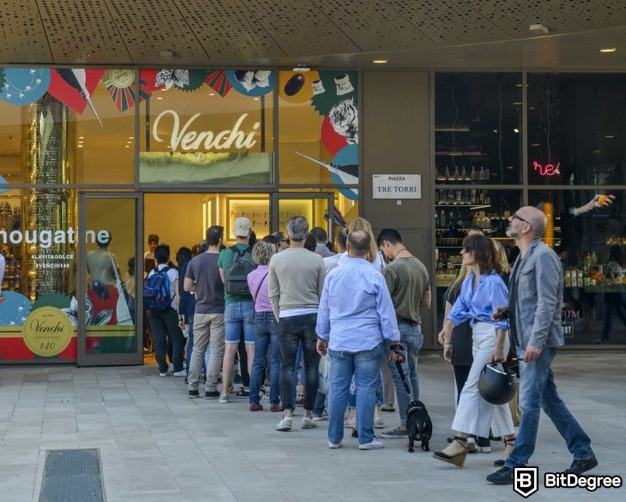 Bitcoin withdrawal pending: people form a long queue to purchase an ice cream gelato.