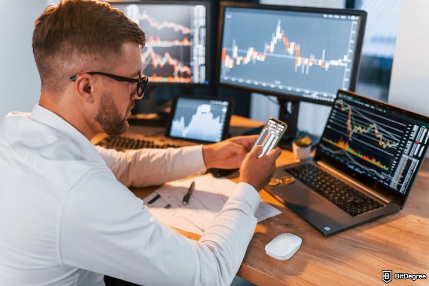 Bitget Canada: a person looking at multiple trading charts. Bitget Canada: a person looking at multiple trading charts.