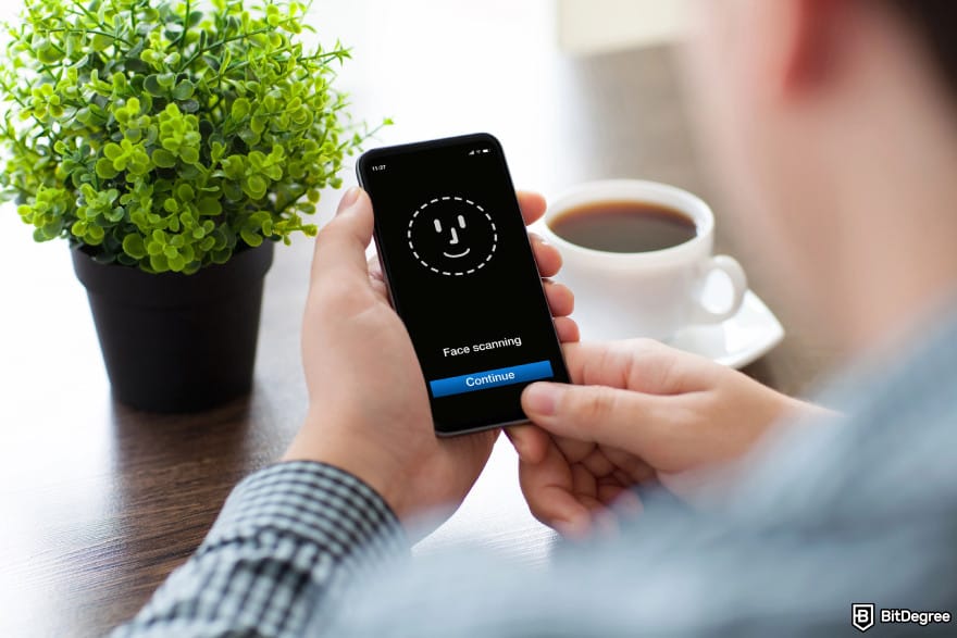 BitMart Card review: a person verifying their identity by doing a face scan.