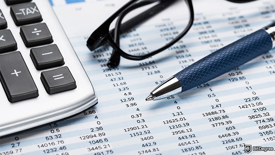 BitMart exchange review: calculator, glasses and pen.