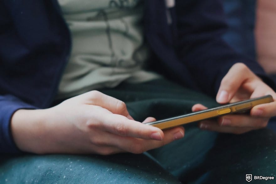 BitStarz review: a person holding a phone horizontally. BitStarz review: a person holding a phone horizontally.