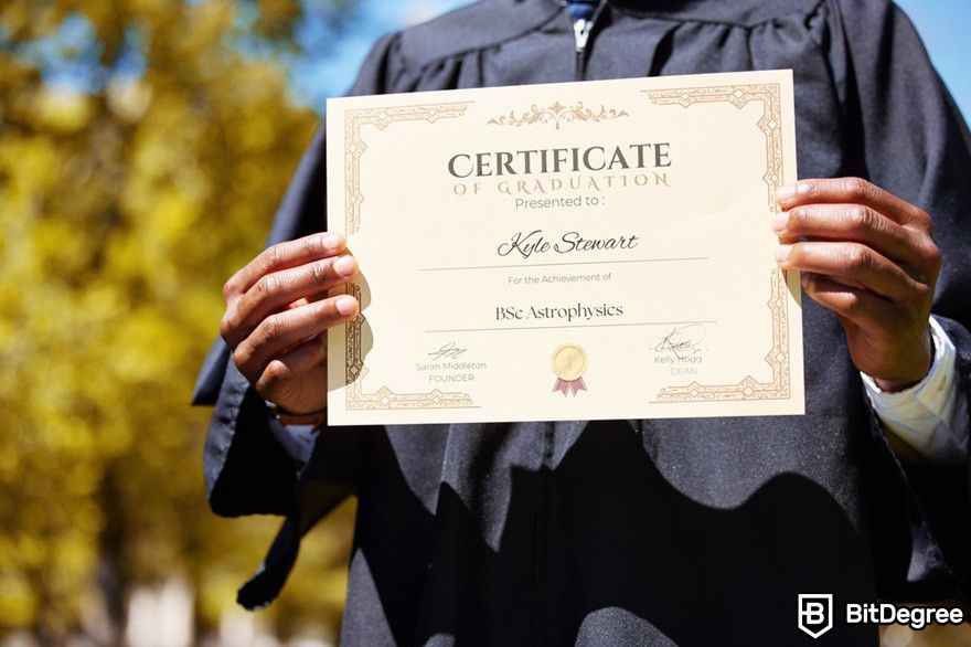 Blockchain education: A man holding a diploma certificate.