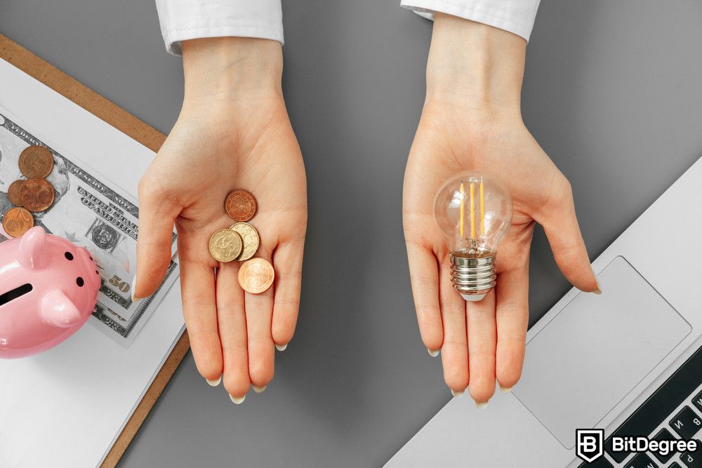 Blockchain for energy: a person holding coins and a lamp bulb.