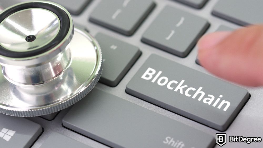 Blockchain for enterprises: a person pressing on a Blockchain key on a keyboard near a stethoscope.