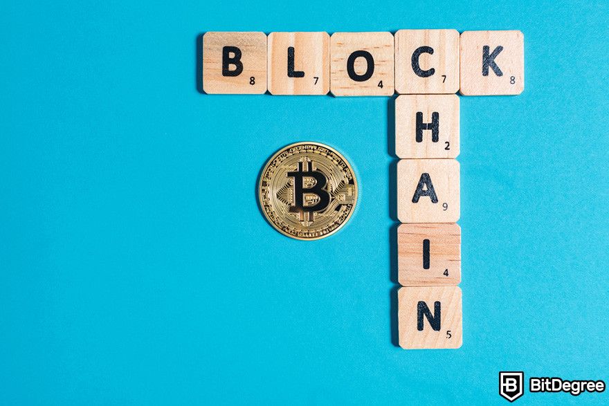 Blockchain in banking: scrabble tiles spelling 'BLOCKCHAIN' with a Bitcoin coin in the center, against a blue background.