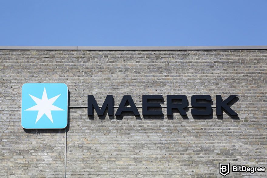 Blockchain in finance: Maersk logo on a building wall.