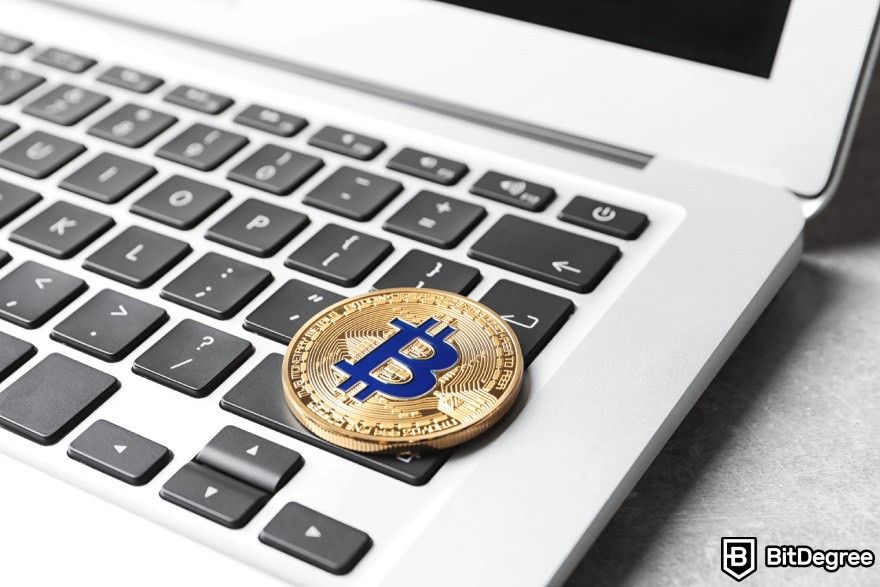 Blockchain platform: Bitcoin placed on top of a laptop.