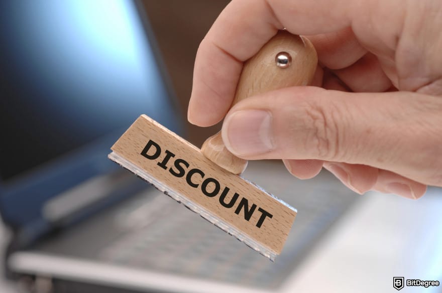 Bybit Earn: a stamp with the word "discount" written on it.