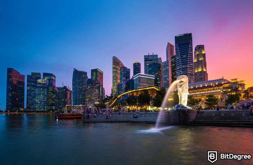 Bybit restricted countries: the merlion statue with the backdrop of the Singaporean skyline.