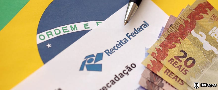 Bybit taxes: Brazilian tax report with stacks of Brazilian Real bills on top.