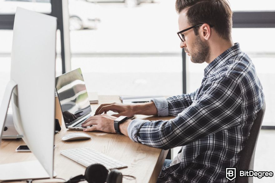 Can ChatGPT create a website: a man sitting at his computer.