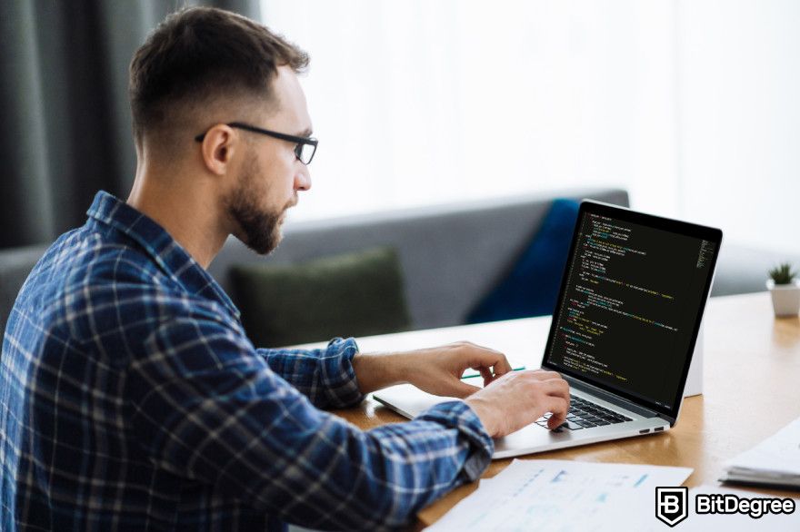 ChatGPT integration: a man programming on his laptop.