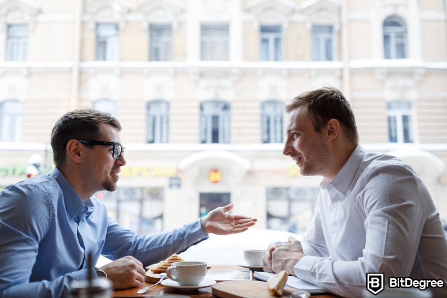 ChatGPT review: two men having a conversation.