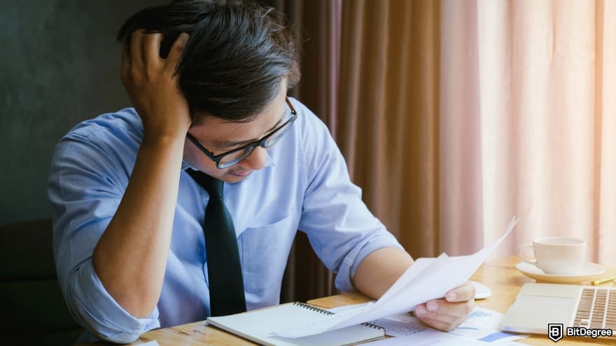 Coinbase fees: a stressed person paying fees. Coinbase fees: a stressed person paying fees.